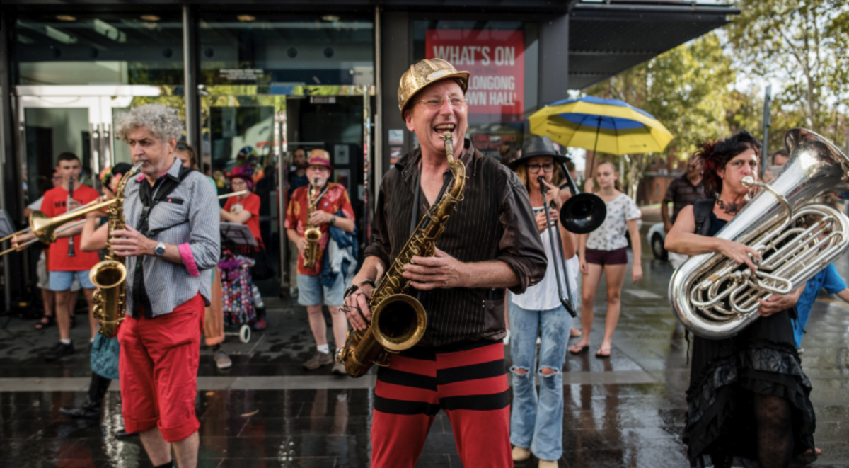 A musician plays saxophone at Honk! Festival